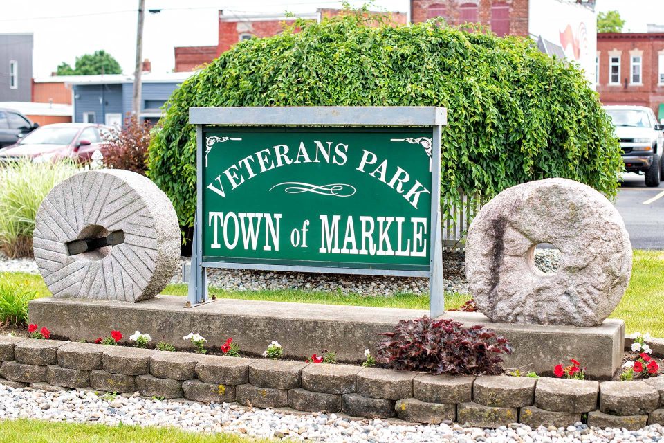 Veterans Park Town of Markle sign in white text on a green background.