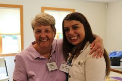 Nancy Breiner and Lily Clanin standing with arms around each other and smiling